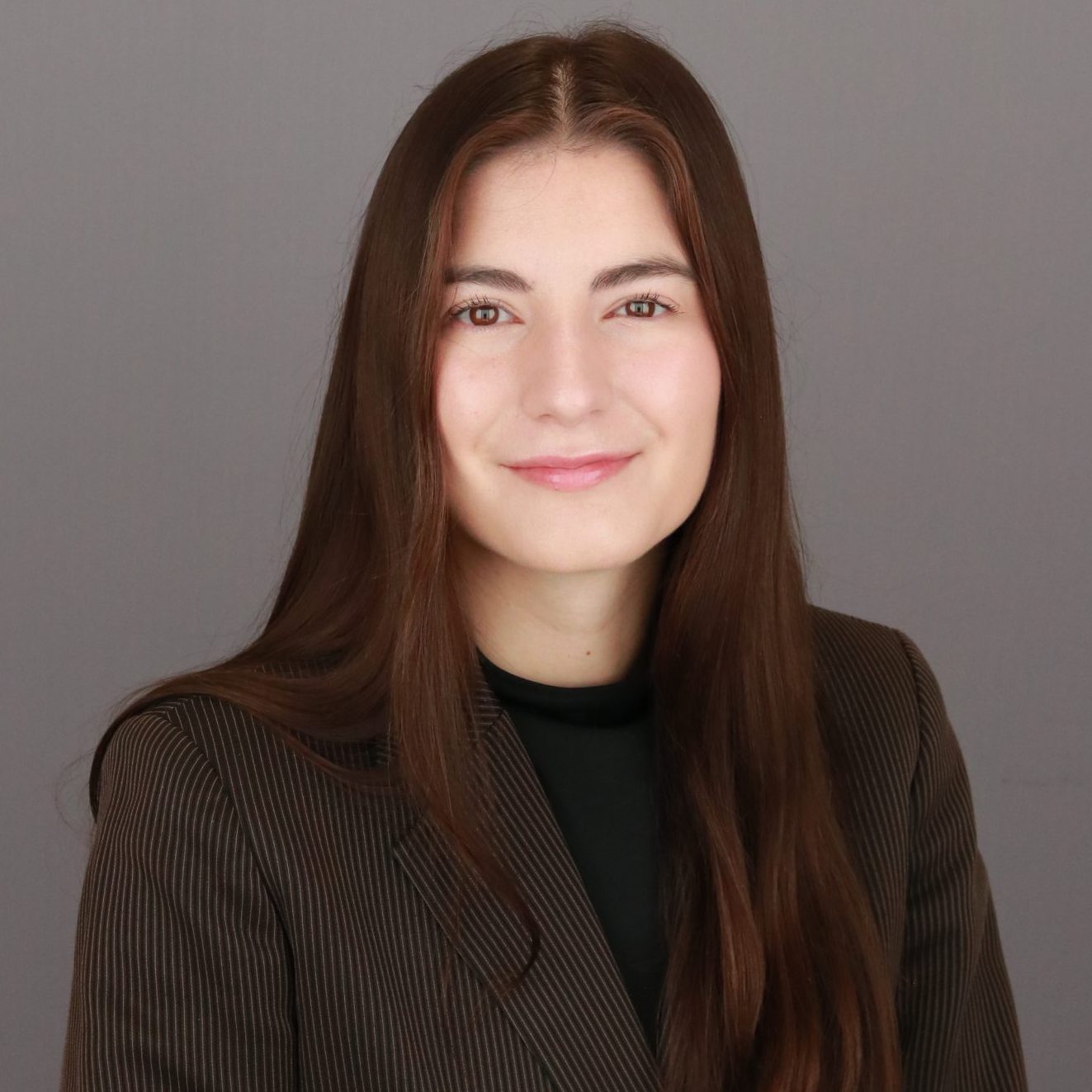 Professional headshot of Ashley Szabo.