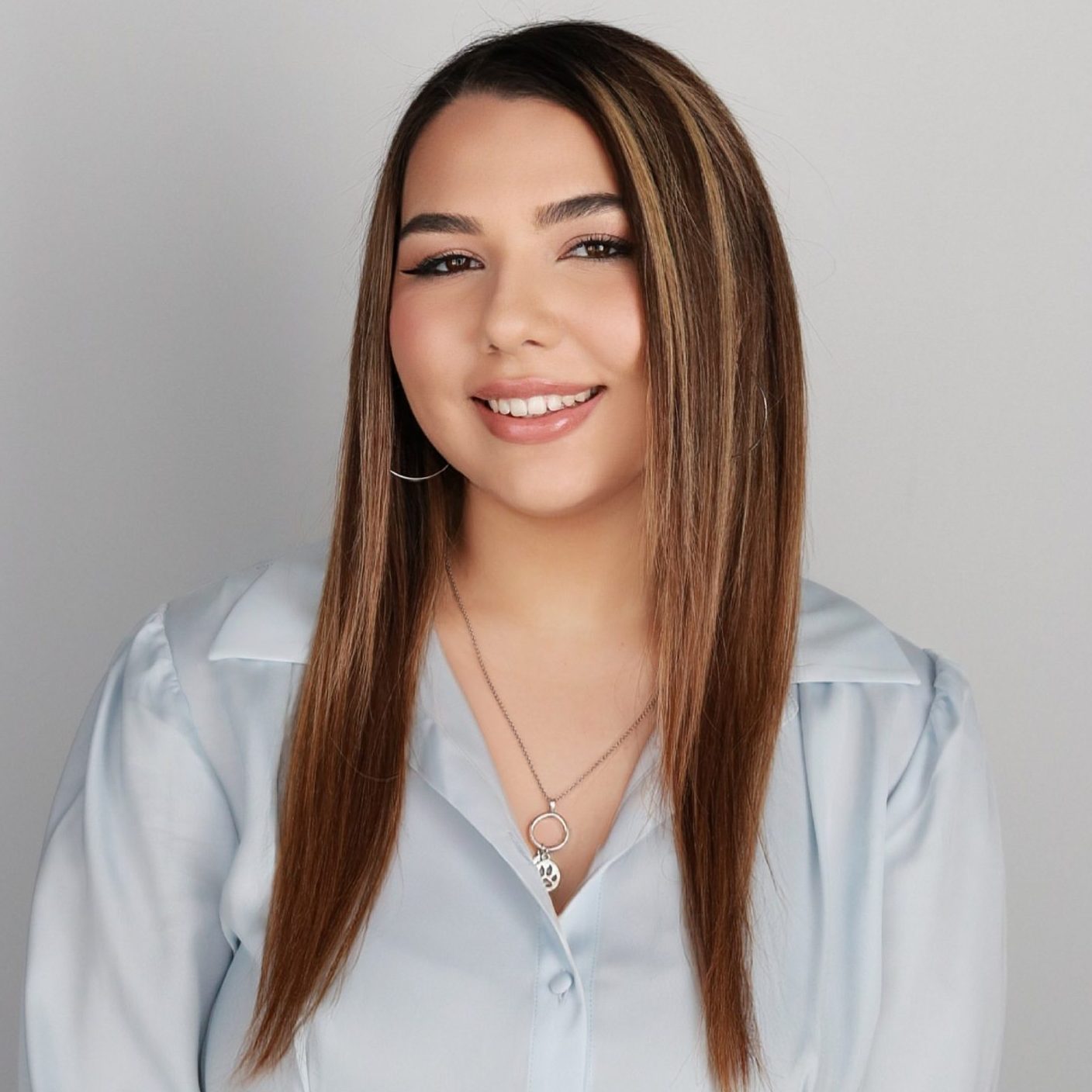 Professional headshot of Maya Wright.